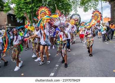 NOTTING HILL, LONDON, ENGLAND- 28 August 2022: Children In Costumes On The First Day Of Notting Hill Carnival 2022