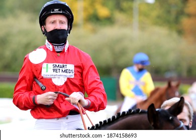 Nottingham Racecourse, Nottingham, UK : 7 October 2020 : Jockey Pat Cosgrave Wearing A Face Mask Whilst On Horse Back At Nottingham Races