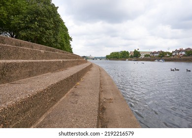 Nottingham, UK 08 18 2022 Concrete Steps On A River Bank                           