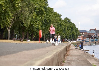 Nottingham, UK 08 18 2022 Woman Jogging On A River Bank
                        