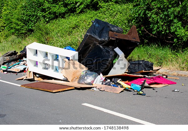 Nottingham/UK-June/02/2020.\
Rubbish dumped on a country lane.  Fly tipping causing\
environmental\
pollution.