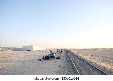 Nouadhibou, Mauritania - January 13 2019: People Waiting For Iron Ore Train. 