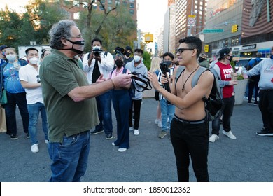 Nov 07, 2020 New Yorker Celebrating The Winning Of Joe Biden For The America President 2020 In Union Square, Trump Supporter Showing Up Without Mask While A Man Giving Him A Mask, New York City, USA