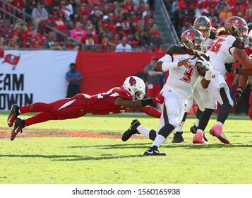 Nov 10, 2019; Tampa, FL USA;  Tampa Bay Buccaneers Quarterback Jameis Winston (3) Scrambles For Yardage While Arizona Cardinals Strong Safety Budda Baker (32) Tries To Tackle Him.