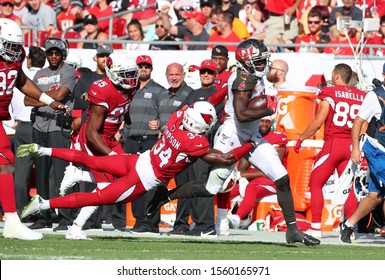 Nov 10, 2019; Tampa, FL USA;  Tampa Bay Buccaneers Wide Receiver Chris Godwin (12) Runs After A Catch While Arizona Cardinals Strong Safety Jalen Thompson (34) Tries To Make A Tackle. 