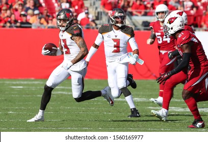 Nov 10, 2019; Tampa, FL USA;  Tampa Bay Buccaneers Wide Receiver Mike Evans (13) Runs For Yardage After A Catch Against The Arizona Cardinals During An NFL Game.