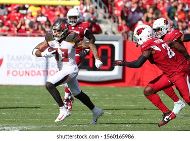 Nov 10, 2019; Tampa, FL USA;  Tampa Bay Buccaneers wide receiver Mike Evans (13) runs for yardage after a catch against the Arizona Cardinals during an NFL game.