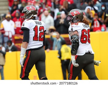 Nov 14, 2021; Landover, MD USA;  Tampa Bay Buccaneers quarterback Tom Brady (12) and Tampa Bay Buccaneers center Ryan Jensen (66) during an NFL game at FedEx Field. (Steve Jacobson, Image of Sport)