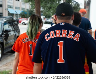 NOV 3rd 2017. Houston, Texas, United States of America: Two Astros fans marching to the World Series TItle celebration, with Correa shirts, in Downtown Houstown
