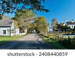 Nova Scotia Sherbrooke Village Open Museum Road and Buildings against brilliant early morning sky