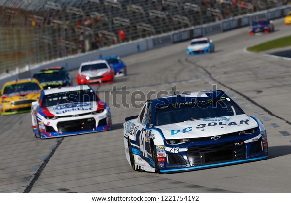 November 04, 2018 - Ft.\
Worth, Texas, USA: Kyle Larson (42) battles through the turns for\
position during the AAA Texas 500 at Texas Motor Speedway in Ft.\
Worth, Texas.