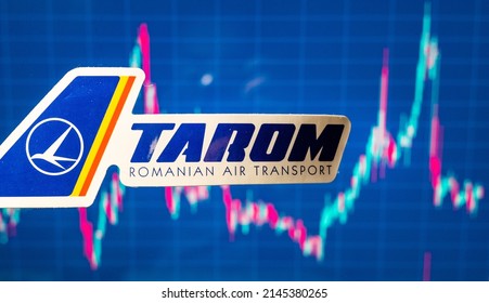 November 10, 2021, Bucharest, Romania. Emblem Of TAROM Airline Against The Background Of The Share Price Chart.