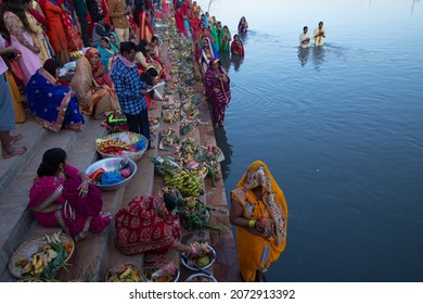 November 10, 2021. Kathmandu, Nepal. Devotees worship the setting sun on the occasion of the Hindu festival of chhath puja on the banks of the river Bagmati in Kathmandu 