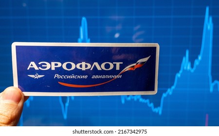 November 10, 2021, Moscow, Russia. Aeroflot Emblem Against The Background Of A Share Price Chart.