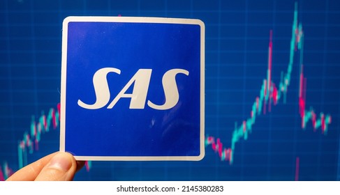 November 10, 2021, Stockholm, Sweden. The Emblem Of The Airline SAS Group Against The Background Of The Share Price Chart.