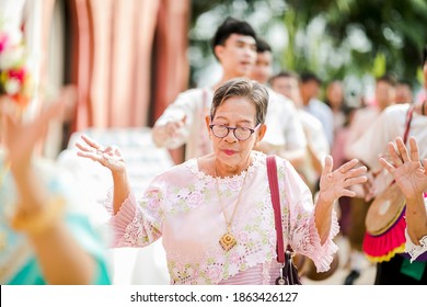 November 11, 2020 - Hua Hin, Thailand : Thai Old Woman Is Dancing While  Joining In Thai Traditional Wedding Ceremony.