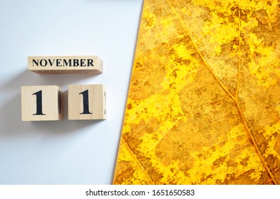November 11, Empty white - Yellow leaf pattern background.