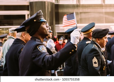 November 11th 2017 - New York, NY - At The Veterans Day Parade, An NYPD Officer Sings Along To The National Anthem.