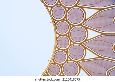 November 13, 2021 UAE, Dubai. Golden honeycomb nest hollow building design background