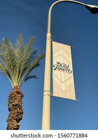 November 14 2019 - Scottsdale, AZ: Banner For Old Town Scottsdale On Light Pole Next To Palm Tree