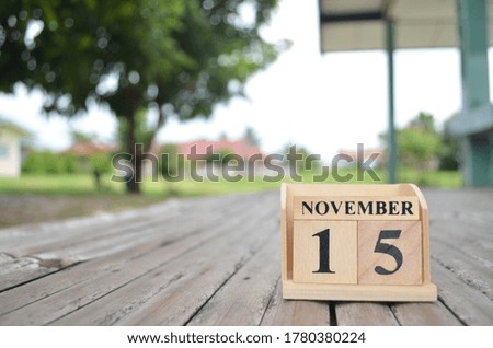 November 15, Number cube with a natural background.