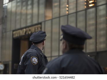 NOVEMBER 18TH 2016--NEW YORK CITY--Unidentified Police Officers From The NYPD Keep Watch Outside Trump Tower, The US President Elect, Donald Trump's HQ On 5th Avenue In NYC. 