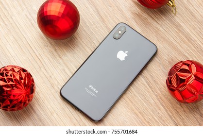 November 2017. IPhone 10 Lies On A Table Next To Christmas Balls.
The Smartphone Lays The Screen Down On A Wooden Surface.