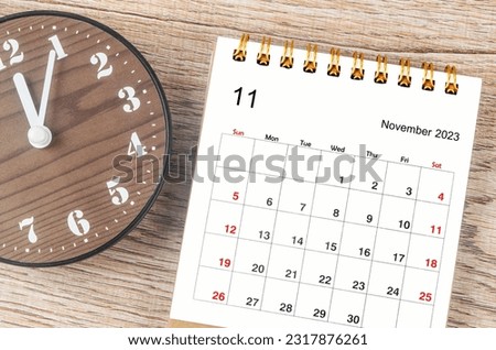 November 2023 Monthly desk calendar for 2023 year with clock.