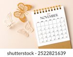 November 2024 desk calendar for the organizer to plan and reminder and butterfly paper on yellow background.