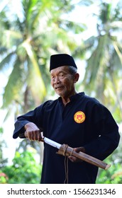 November 21, 2019 - Sabak Bernam, Malaysia. A Local Old Malay Man With His Traditional Martial Art Dress And Pose With The Village Green Background In Malaysia.