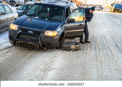 November 24,2014, Coronet Road, Edmonton, Alberta, Canada. A frustrated driver is wondering what has happened with his car on his next day follow up visit to repair shop.  - Shutterstock ID 236555017