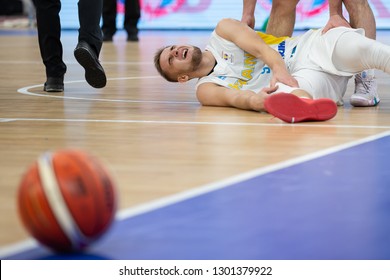 NOVEMBER 29, 2018 - ZAPORIZHIA, UKRAINE: Oleksandr Kobets portrait falling down on the ground after getting terrible anterior cruciate ligament injury. FIBA World Cup 2019 Qualifiers Ukraine-Slovenia