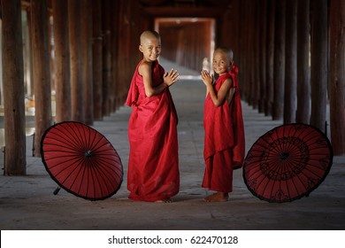 November 4, 2017 Novice monks raise their hands to greet each other. Before going to class.MONK  Southeast Asian young  Buddhist monk In one of the temples in Burma, 