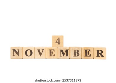 November 4, Wooden cube on isolated white background. Barack Obama, First African American President, First Harry Potter Premier in London, Ronald Reagan, 40th president, Unesco, National candy day