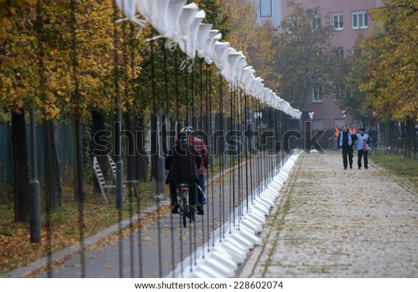 NOVEMBER 5, 2014 - BERLIN: poles for balloons ath\
the former borderline - preparations for the 25th anniversary of\
the fall of the Berlin\
Wall.