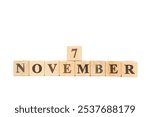 November 7, Wooden cube on isolated white background. Hillary Clinton elected US Senate, First lady, elective office, National Retinol Day, Wales International Film Festival, International Stout Day 2