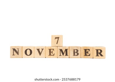 November 7, Wooden cube on isolated white background. Hillary Clinton elected US Senate, First lady, elective office, National Retinol Day, Wales International Film Festival, International Stout Day 2