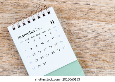November Calendar 2021 on wooden table background. - Shutterstock ID 2018060153
