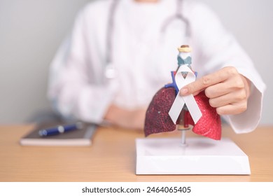 November Lung Cancer Awareness month. Doctor with Smoker Lung anatomy model and White ribbon in hospital. Healthcare and World Cancer day concept - Powered by Shutterstock