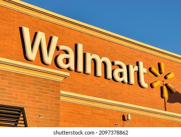 Novi, Michigan, USA - AUGUST 8, 2021: Walmart sign at store exterior. Walmart is an American large retail corporation operates discount stores across the world.