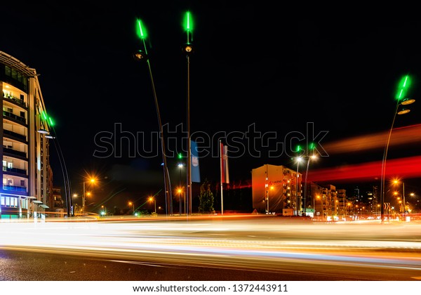 Novi Sad, Serbia\
April 15, 2019: Traffic roundabout in the boulevard of Europe in\
Novi Sad, Serbia by\
night.\
