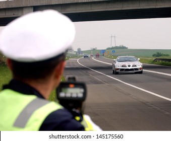 NOVI SAD, SERBIA - CIRCA MAY 2006: Policeman controls speed at E-75 highway circa May 2006 in Novi Sad