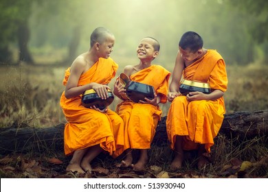 Novice monks  laughing happily.