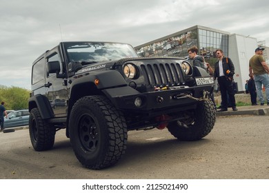 Novosibirsk city, Russia - May 19, 2019: legendary american suv 2012 Jeep Wrangler Rubicon (JK) at the local meeting of american cars' owners. Big and black off-road car with extreme wheels 