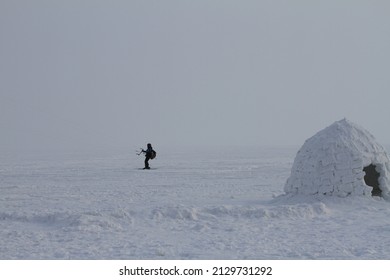 NOVOSIBIRSK RESERVOIR, RUSSIA - 13 FEBRUARY 2022: People ride snow kites on the frozen sea.