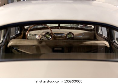Novosibirsk, Russia - 01.30.19: View from rear window on the steering wheel and the interior of the old Russian car of the executive class released in the Soviet Union beige GAZ m-20 pobeda