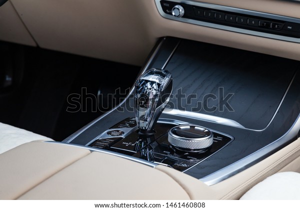 Novosibirsk, Russia - 07.20.2019: View to the\
white and brown interior of BMW X7 M Performance with dashboard,\
media system control panel and diamond shift gear after cleaning\
before sale on\
parking