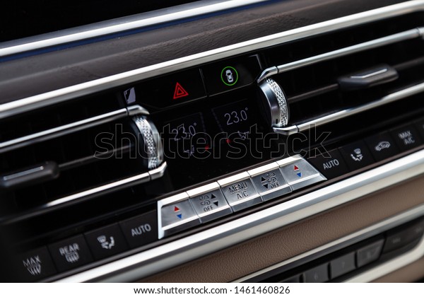 Novosibirsk,\
Russia - 07.20.2019: View to the white and brown interior of BMW X7\
M Performance with dashboard,ventilation duct and climate-control\
panel after cleaning before sale on\
parking