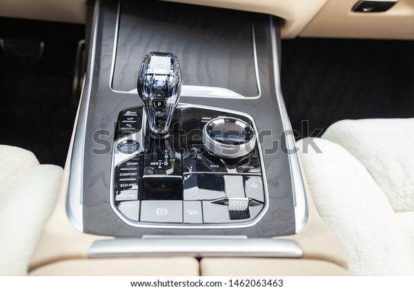 Novosibirsk, Russia - 07.20.2019: View to the\
white and brown interior of BMW X7 M Performance with dashboard,\
media system control panel and diamond shift gear after cleaning\
before sale on\
parking
