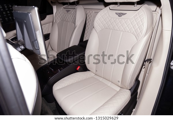 Novosibirsk, Russia -\
08.01.18: Interior view with rear seats of luxury very expensive\
new black Bentley Bentayga car stands in the washing box waiting\
for repair in auto\
service